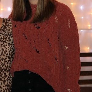 Red/maroon colored knit sweater